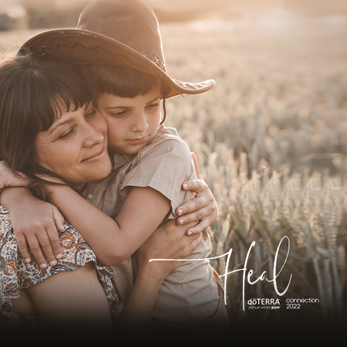Woman holding her son at a field