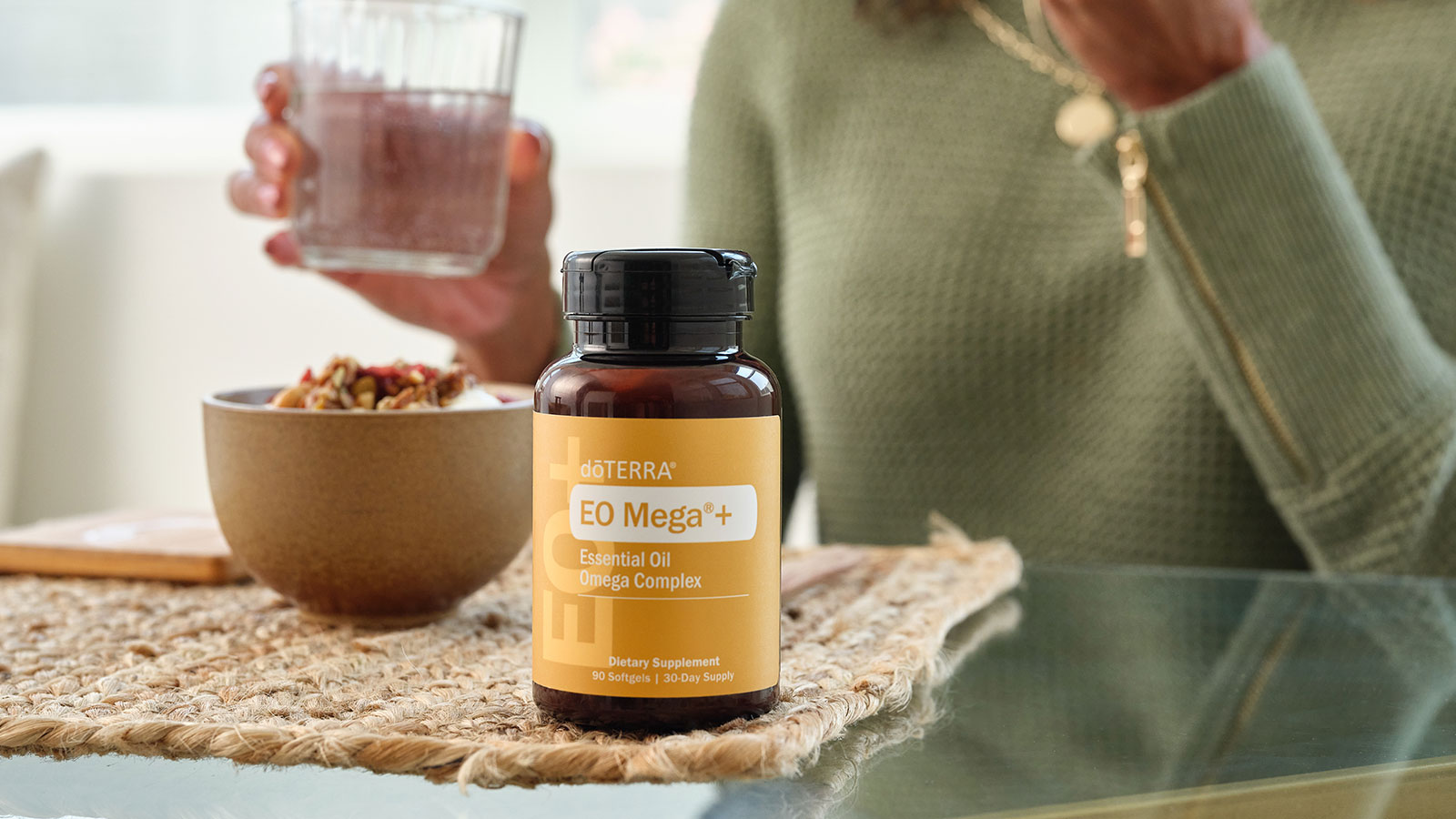 A woman taking EO Mega