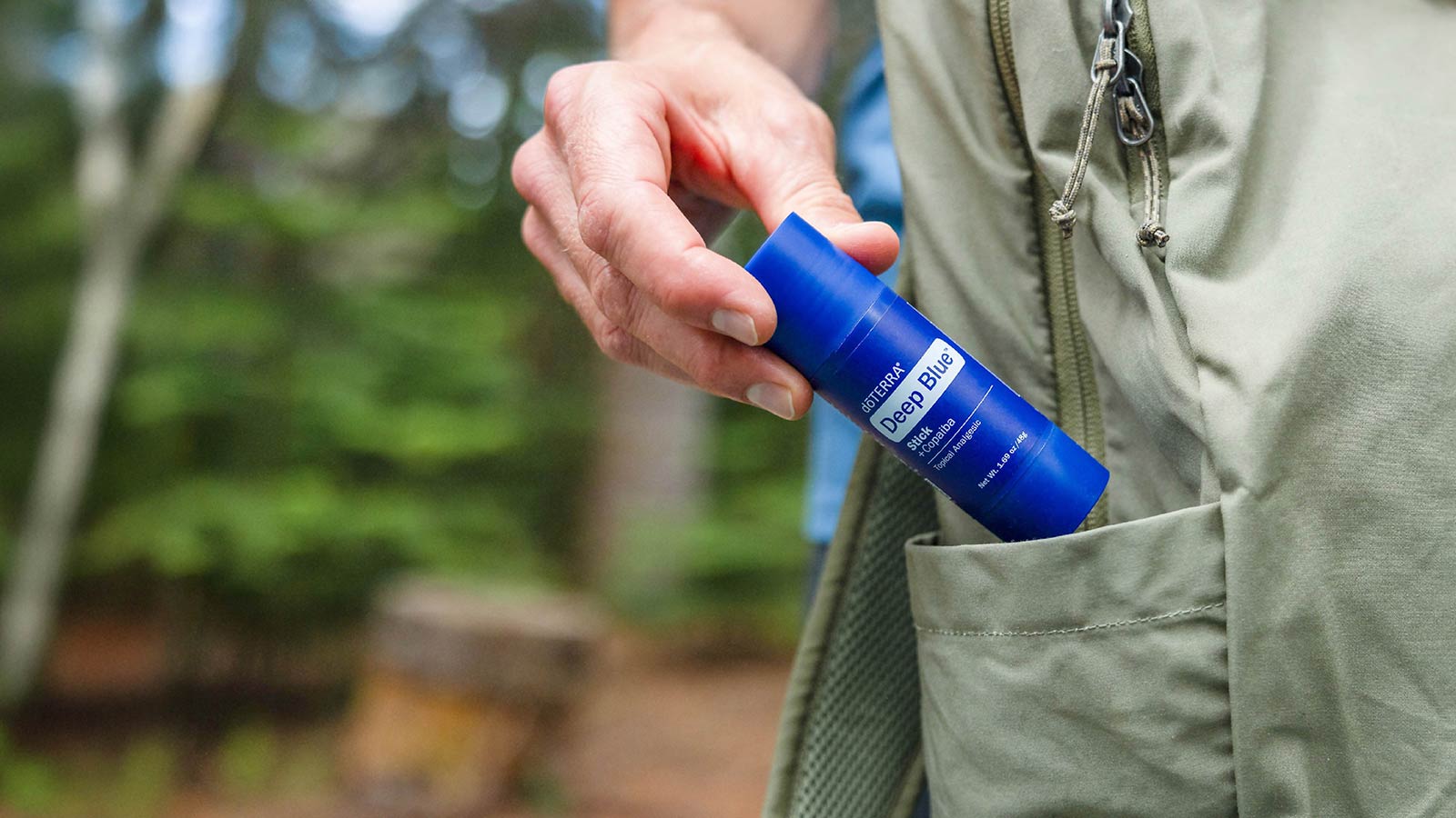 A man taking Deep Blue out of his pocket