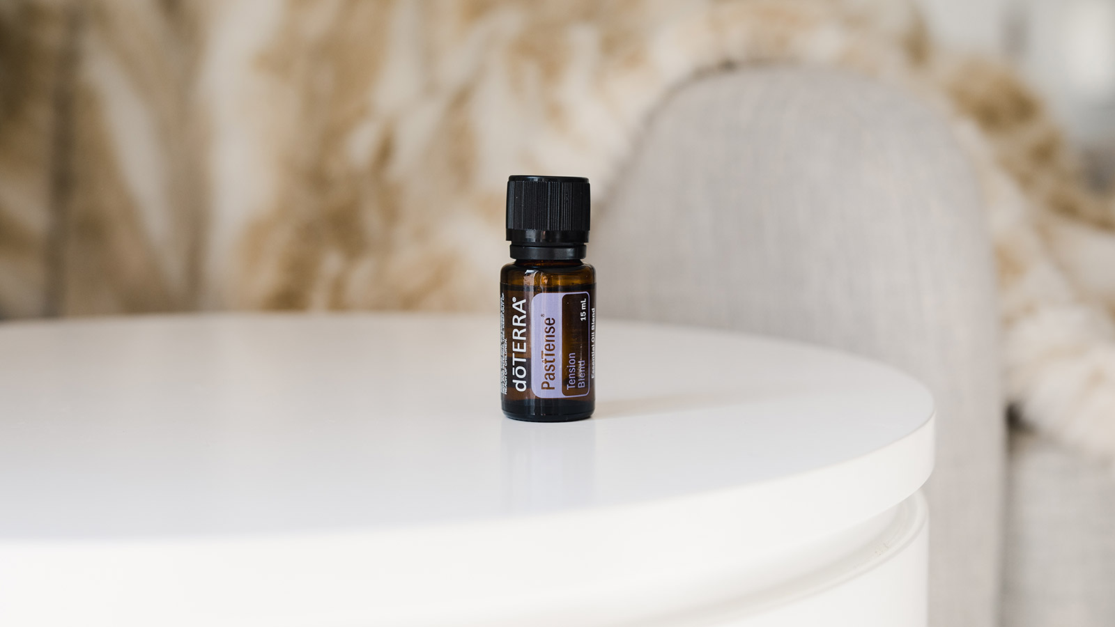 doTERRA’s PastTense sitting on round white table.