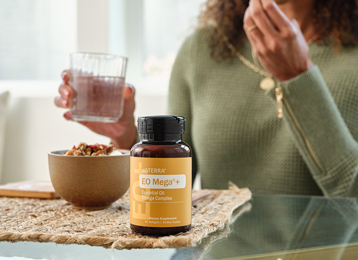 A woman taking EO Mega