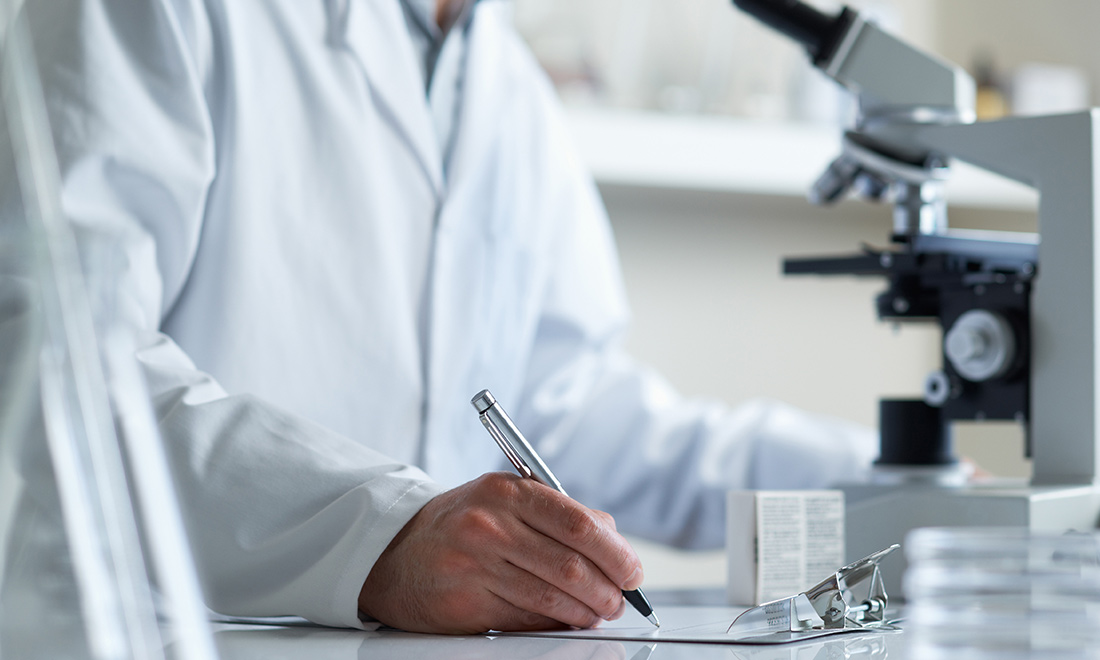 A scientist with a microscope