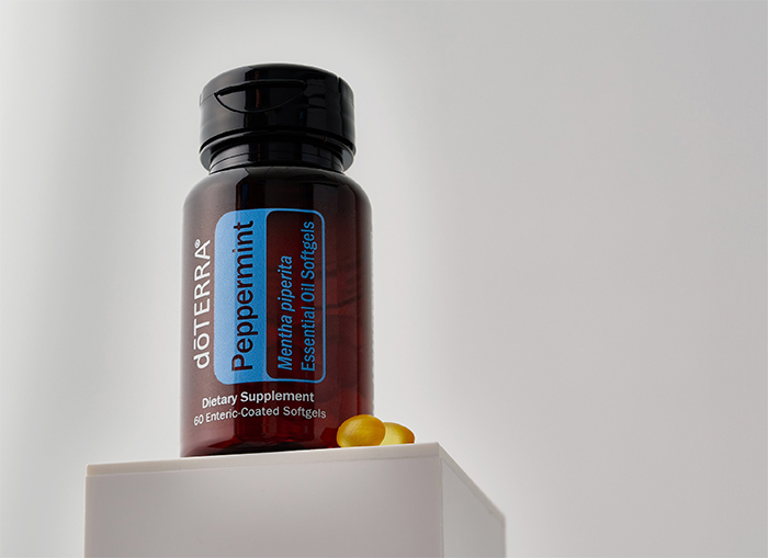 Peppermint softgels bottle on a stand with white background.