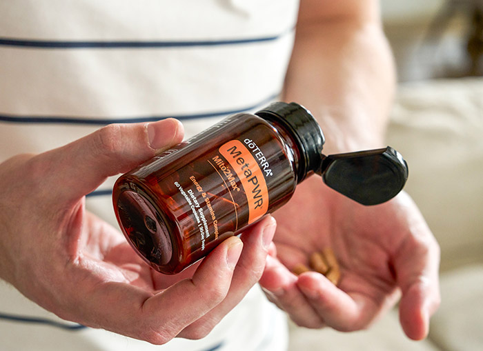 A person holding MetaPWR Mito2Max