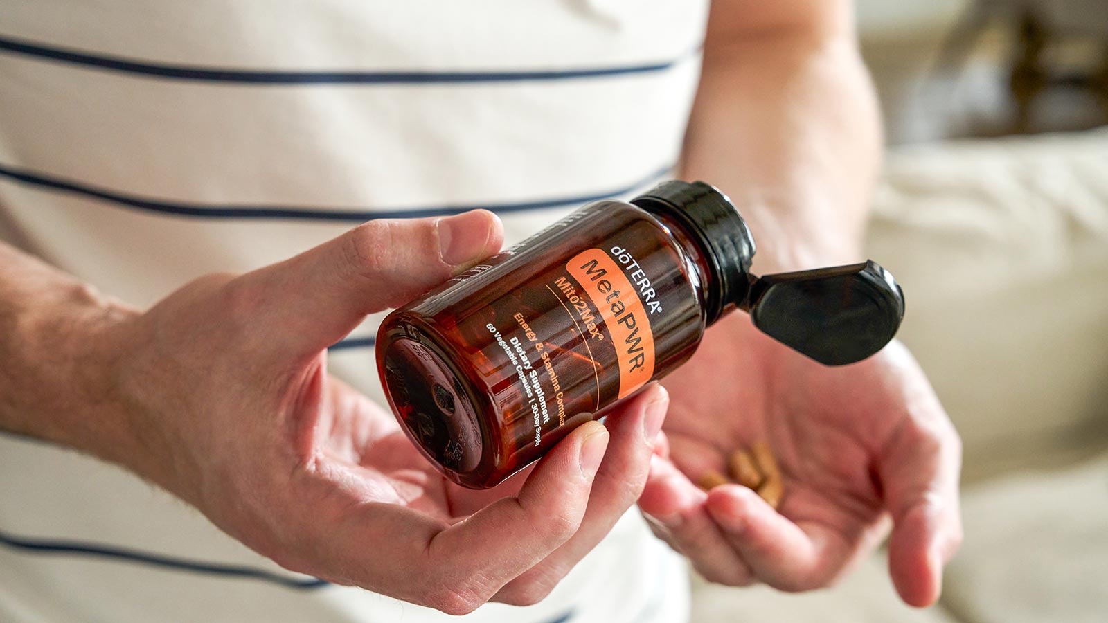 A person holding MetaPWR Mito2Max