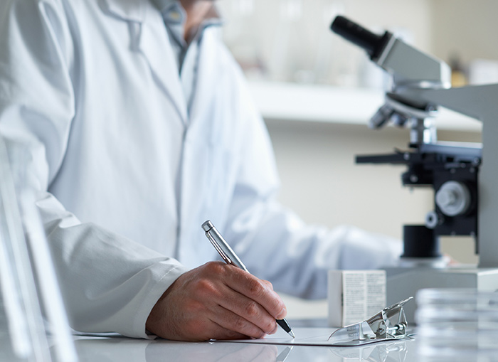 A scientist with a microscope