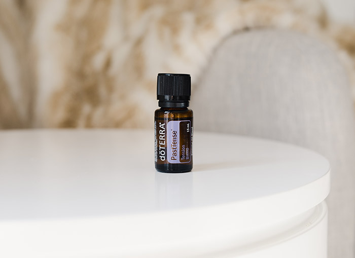 doTERRA’s PastTense sitting on round white table.