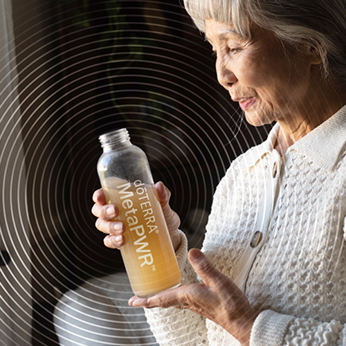 Lady drinking doTERRA MetaPWR