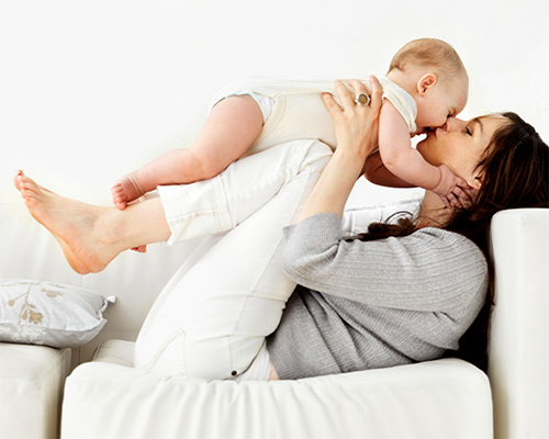 Mom playing with her baby