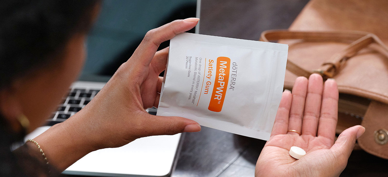 A woman pouring MetaPWR gum into her hand