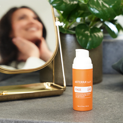 doTERRA sun Face Mineral Sunscreen over a table with a mirror