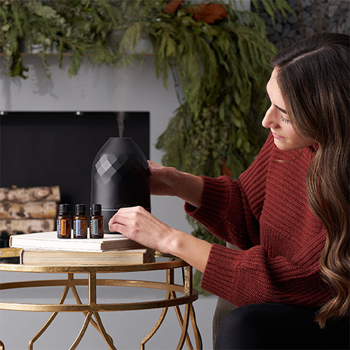 Woman using a diffuser